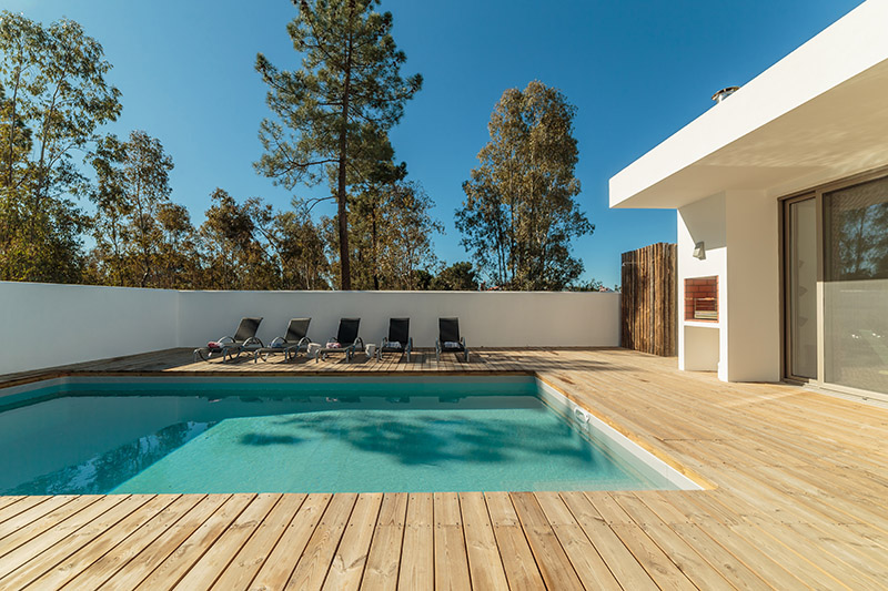 Modern,House,With,Garden,Swimming,Pool,And,Wooden,Deck